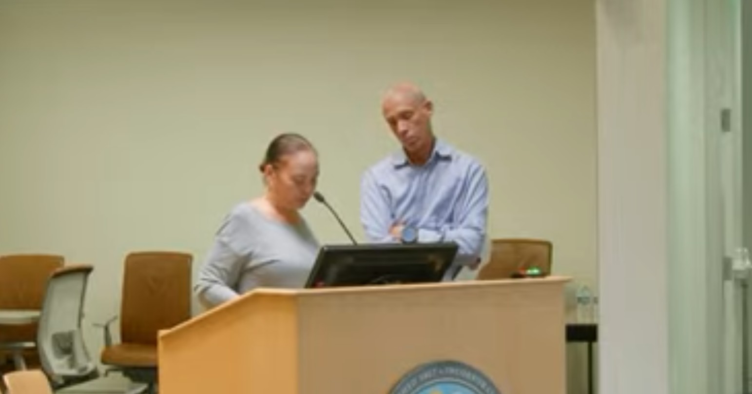 Chrystal speaking at the podium